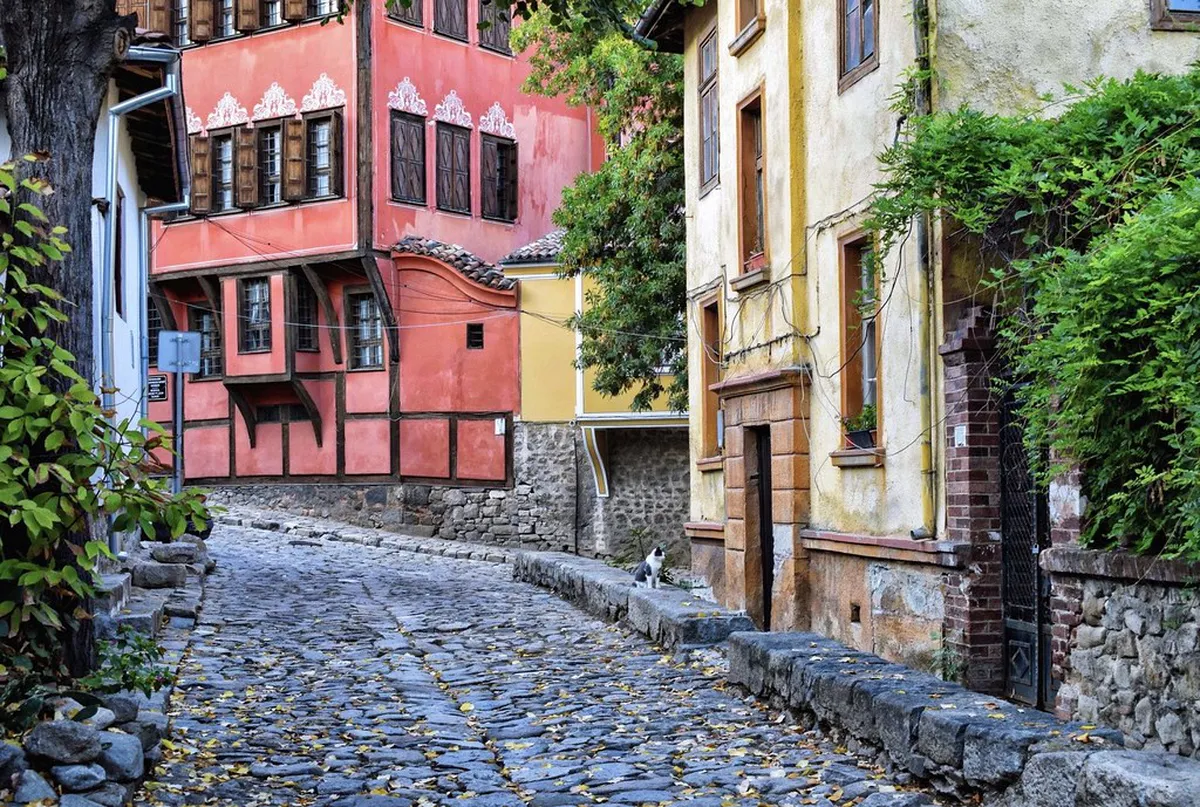A cobbled street lined with traditional Bulgarian Revival houses in Plovdiv